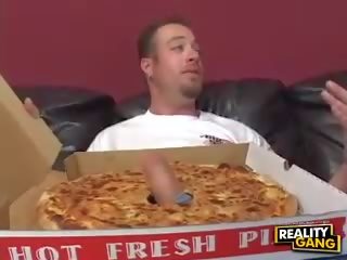 Milf with big tits gives a blowjob to a pizza delivery mistress